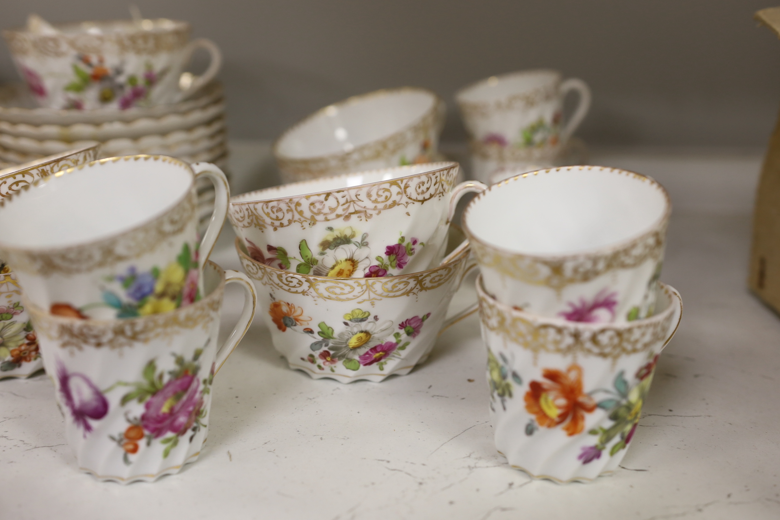 A quantity of Dresden flower painted tea wares